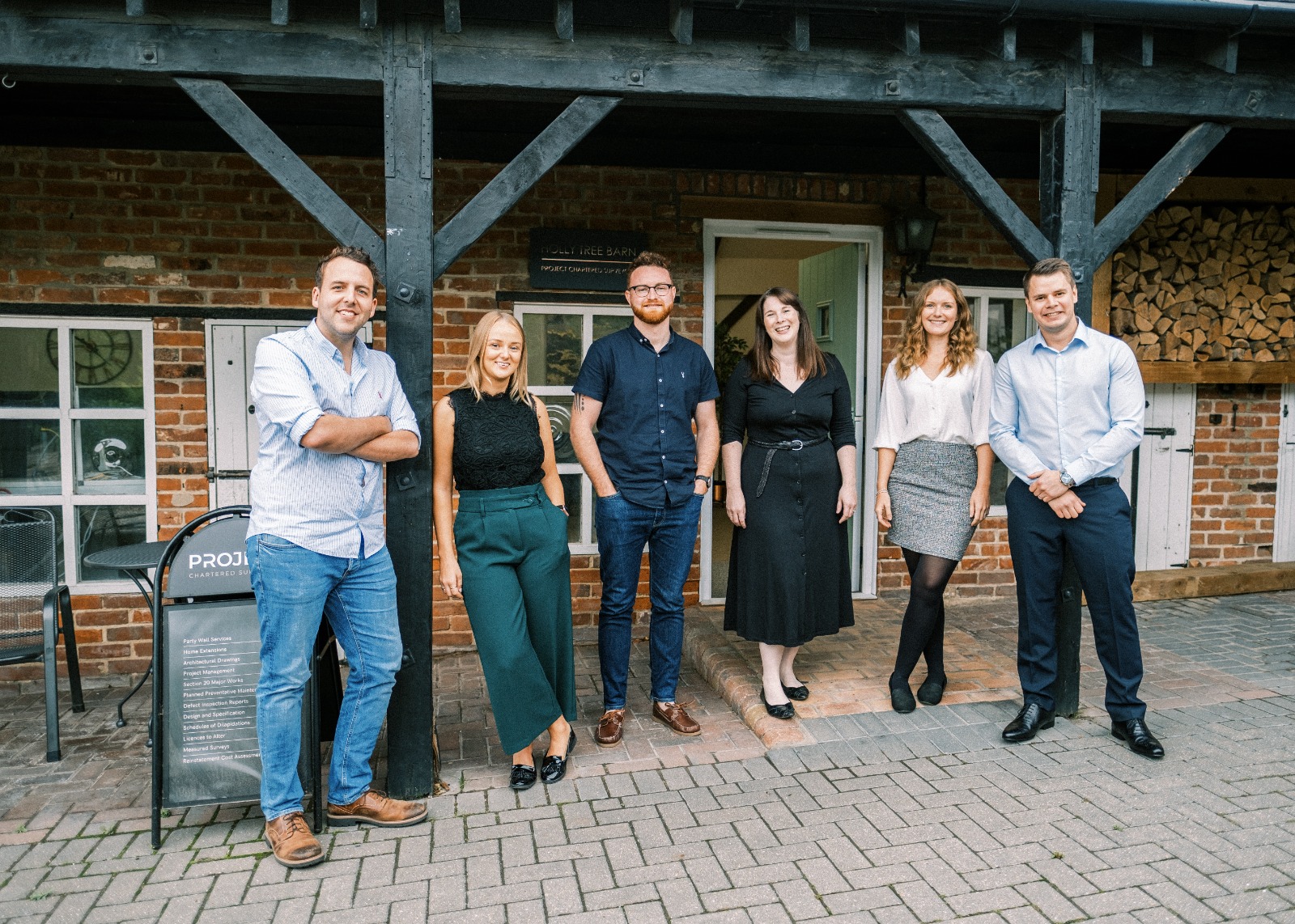 The original Project Chartered Surveyors team of six outside Holly Tree Barn, Rayleigh, in 2020